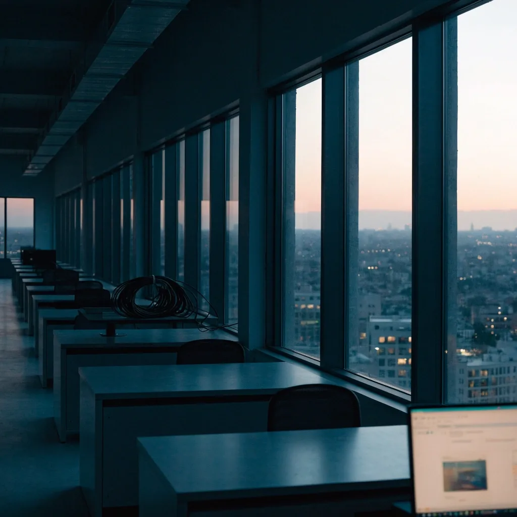 Empty Sidebench studio at the end of the day with city light through tall windows